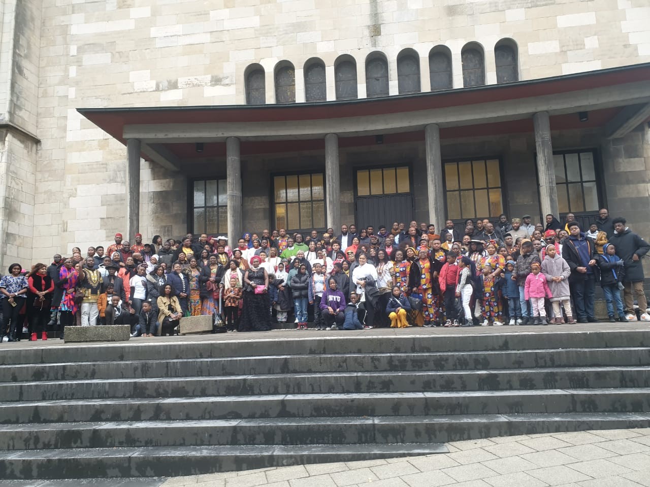 Holy Family African Catholic Community gathered in front of the church in Essen